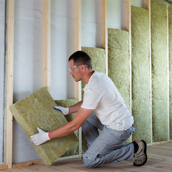 man working with insulation